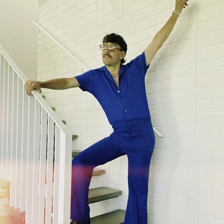 Miller poses on the stairs inside the couple’s new abode. Picture: Josh Miller/Instagram