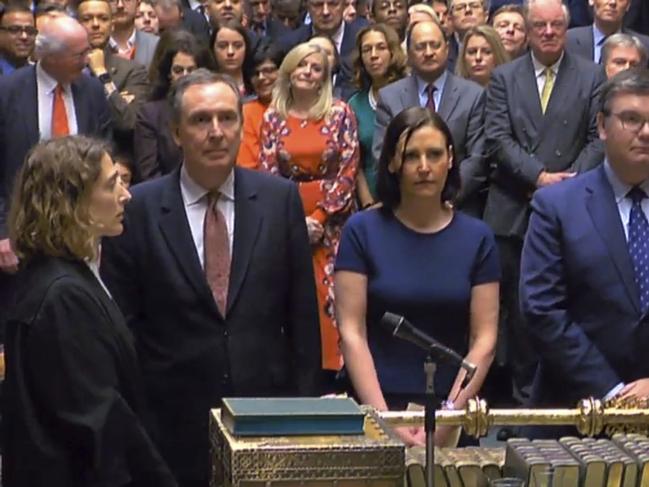 In this grab taken from video, MPs prepare to announce the result of a vote on the Prime Minister's Brexit deal in the House of Commons, London, Tuesday Jan. 15, 2019.  UK Parliament rejected Prime Minister Theresa May's Brexit deal with the European Union by 432 votes to 202 . (House of Commons/PA via AP)