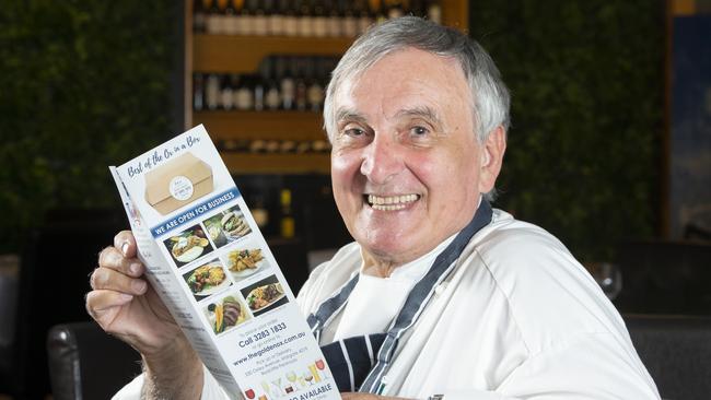 Golden Ox owner Nick Tzimas with his new takeaway menu. Picture: Renae Droop