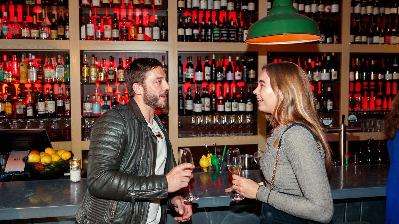 Sam Norton and Devon Verberkmoes mingle at an Unwritten Dating club event for 30-45 year olds at The Wine Library in Woollahra. Picture: Max Mason-Hubers