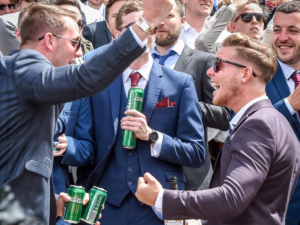 You beauty! These lucky, err, astute punters celebrate the win of Kinema in race 3. Picture: Jake Nowakowski