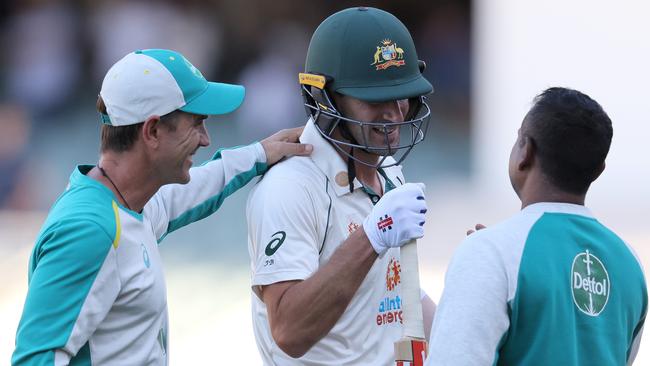 Justin Langer congratulates Joe Burns after his gutsy half century in Adelaide