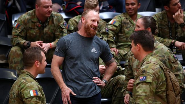 Mark Donaldson talks to soldiers during the Invictus Games in Sydney. Picture: Cameron Spencer