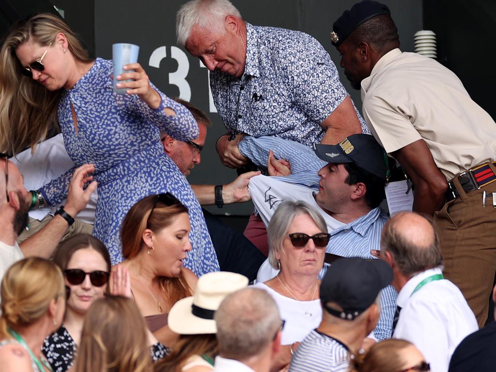 Security staff and spectators remove Drew Pavlou. Picture: Ryan Pierse/Getty Images