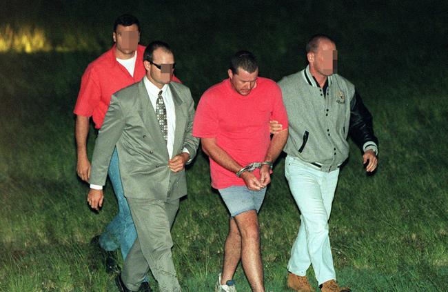 Abbott under arrest being escorted to Woodford Correctional Centre in Brisbane, on May 6, 1998.