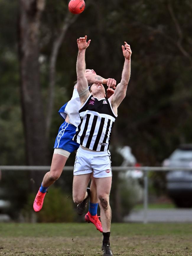 EDFL: Sunbury Kangaroos’ Dean Halliwell collects John O'Brien of Moonee Valley a bit high. Picture: Andy Brownbill