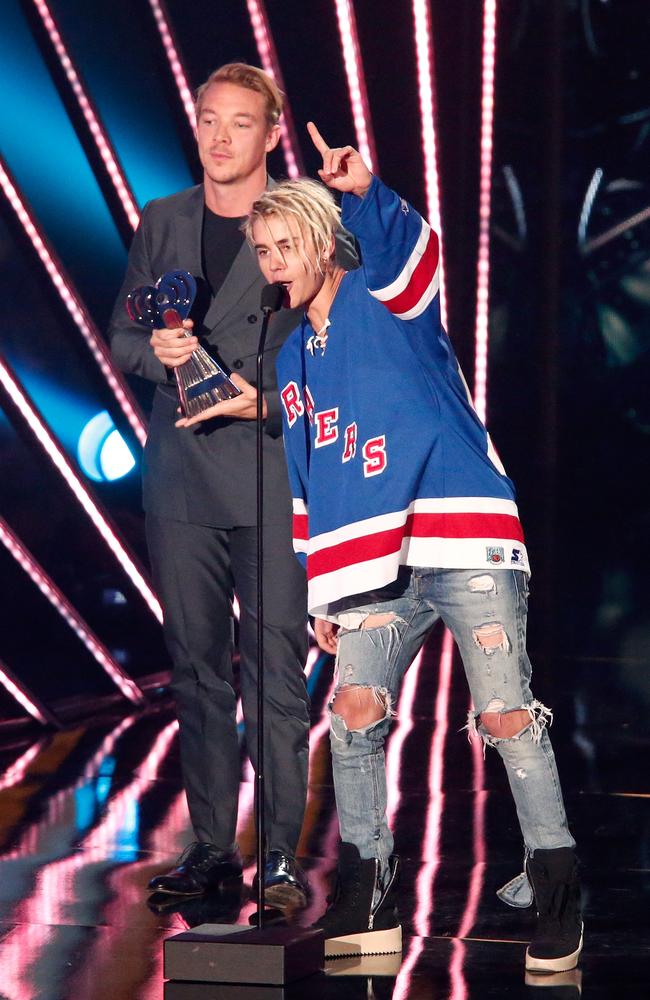 Calvin Harris and Justin Bieber onstage during the iHeartRadio Music Awards. Picture: Getty