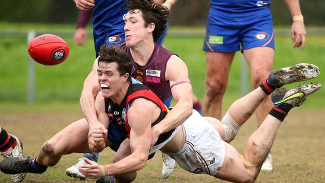 NFL: Eltham’s Daniel Horsfield gets taken down by Riley Loton of Banyule. Picture: Hamish Blair