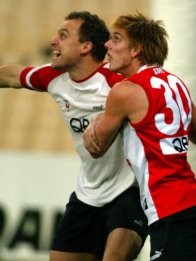 John Longmire battles with Lewis Roberts-Thomson at Swans training. Picture: Phil Hillyard