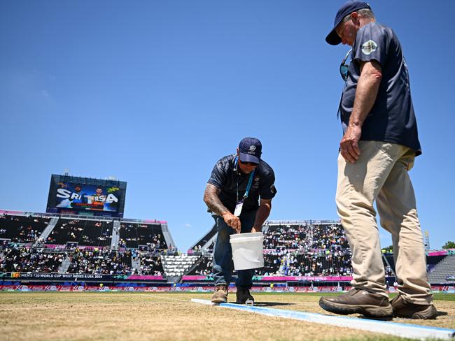 Ground staff work on the pitch during the interval of Sri Lanka and South Africa. Picture: Alex Davidson-ICC/ICC via Getty Images