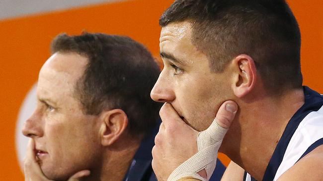 Crows coach Don Pyke and captain Taylor Walker watch Adelaide struggle to move the ball from defence against Hawthorn at the MCG on Saturday night. The Crows managed just 35 inside-50s, the lowest count since 2011. Picture: Michael Klein