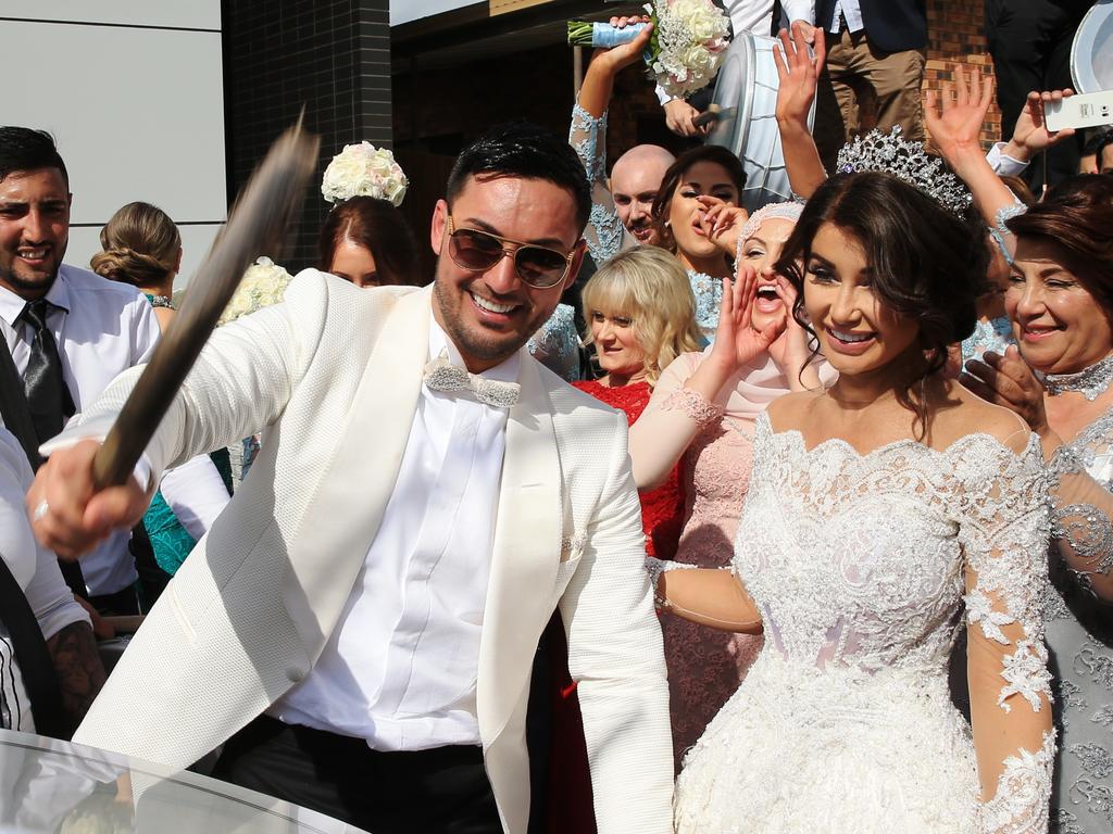 Auburn deputy mayor Salim Mehajer plays the drum as his new wife watches on. Picture: Toby Zerna