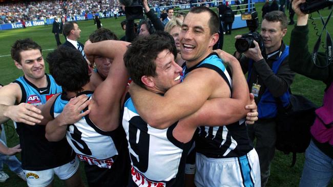 Warren Tredea, right, and Josh Carr celebrate Port Adelaide’s grand final win in 2004.