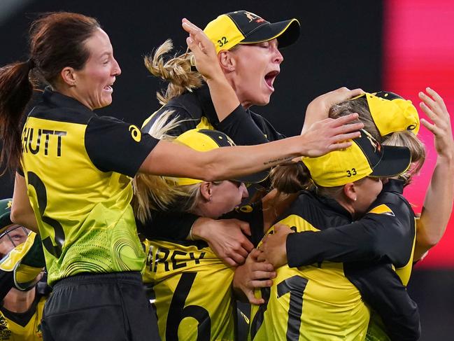 Australian players celebrate their T20 World Cup win on Sunday. Picture: AAP