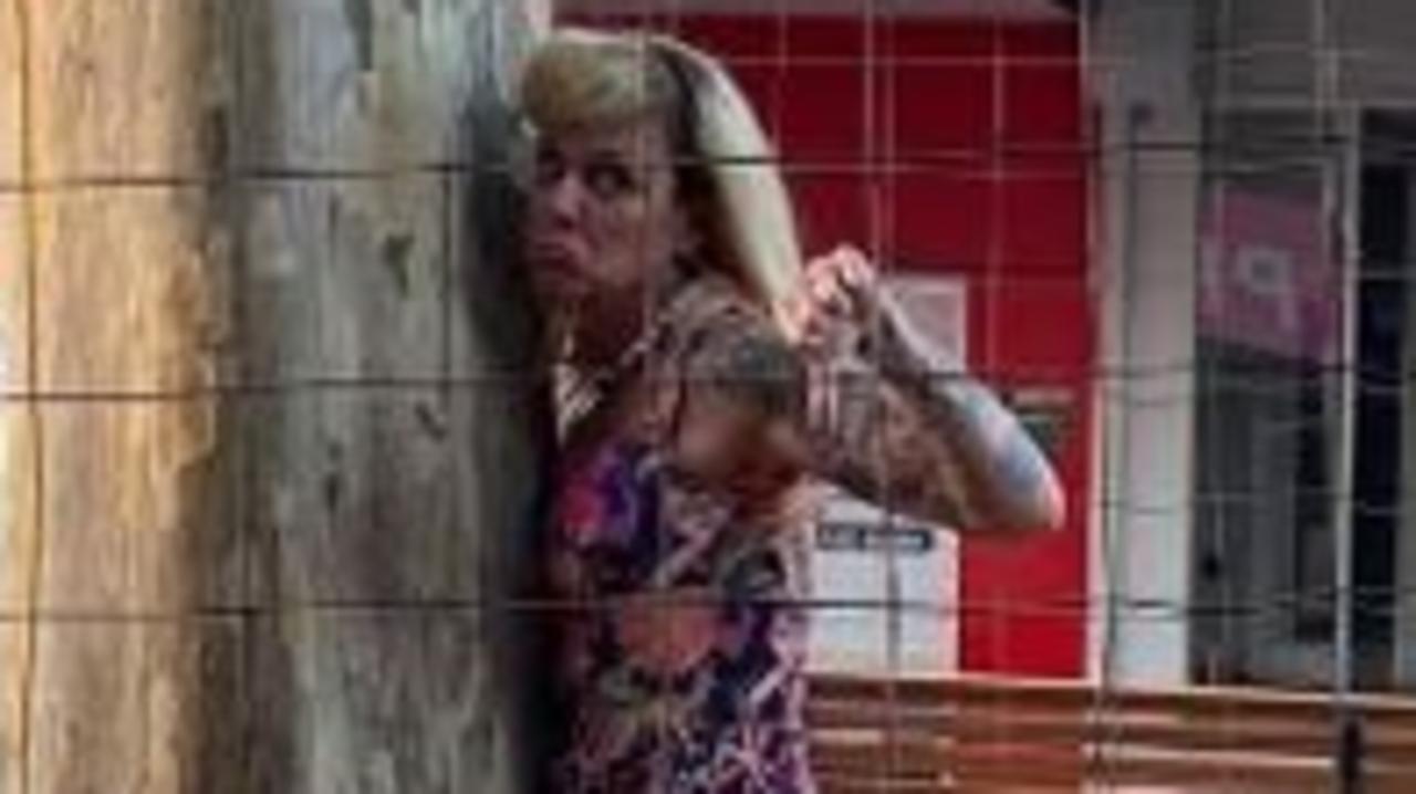 Gympie business owner Stacy Edwards says she will chain herself to two doomed leopard trees as the local council tries to remove them from the CBD on Sunday morning.