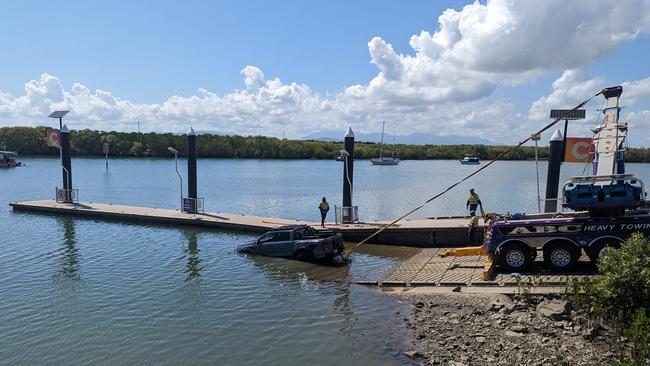 A stolen car being pulled out of the Ross River, near the South Townsville boat ramp. Picture: Supplied