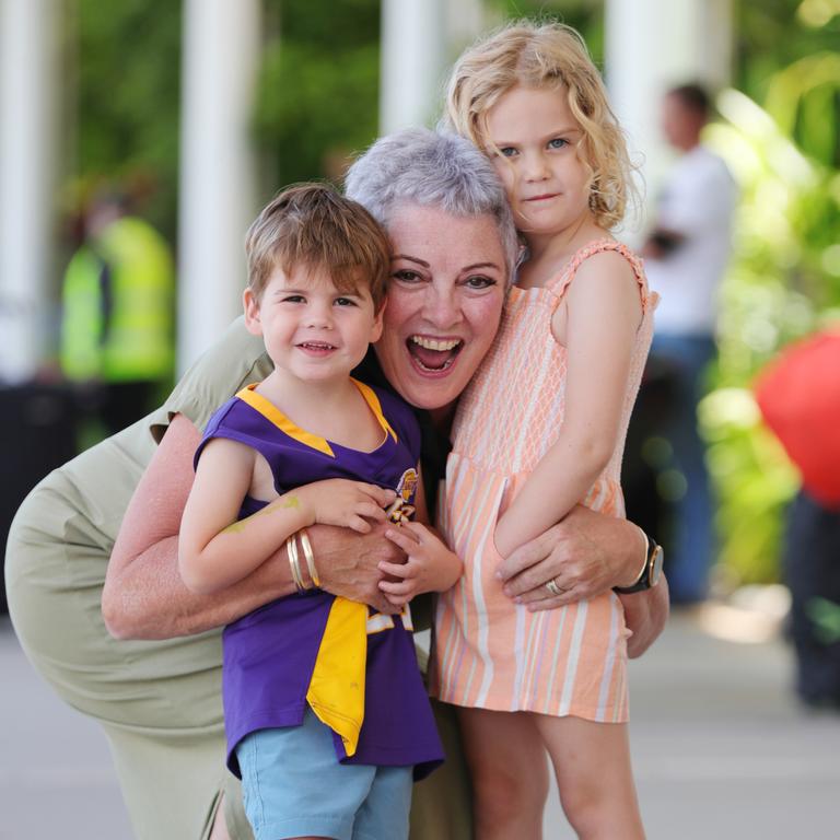 Dale Archer from Sydney reunites with grandchildren Marley 2, and Daisy, 4, at Sunshine Coast Airport. Picture: Lachie Millard