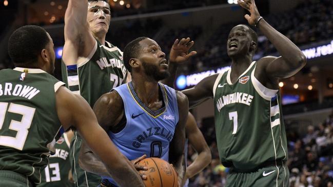 Thon Maker (right) defends against Memphis Grizzlies forward JaMychal Green.