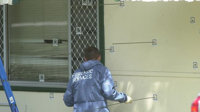 Police investigate the shooting murders in Greenacre in 2003.