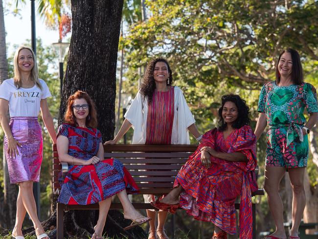 Darwin-based artist Ilma Ali (pictured fourth from the left) has produced 'Flowers Underwater' for her third runway show, which takes place as part of Darwin Festival. Freyzzy Design creator Tatiana Hoffman and Black Cat Couture designer Marcia Russell (pictured first and second) helped design Ms Ali's 2023 runway show. Model Yeimi Salazar (centre) wears a dress from Ms Ali's first show. Slappa's Thongs creator Denise Dunn (far right) wears a dress from Ilma Ali's second runway show.Picture: Pema Tamang Pakhrin