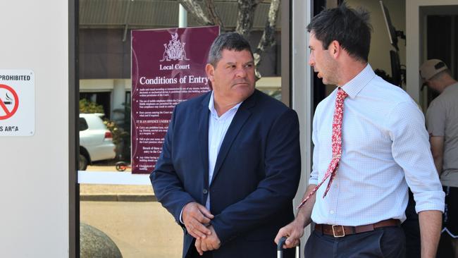 Bootu Creek Mine operator OM Manganese representative Andre de Villiers (left) speaks with lawyer James Stuchbery outside the Darwin Local Court on Monday after the company pleaded guilty to failing to comply with a health and safety duty following a fatal pit wall collapse in 2019. Picture: Jason Walls