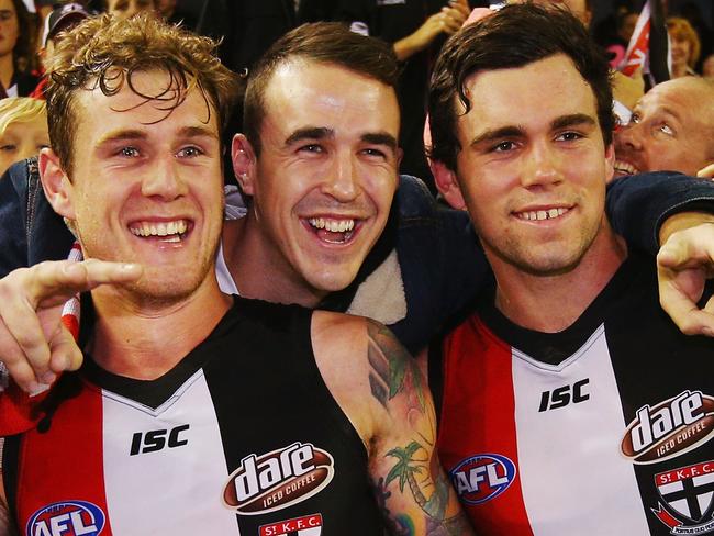 MELBOURNE, AUSTRALIA - MAY 22: Tim Membrey of the Saints (L) and Paddy McCartin celebrate the win with a fan during the round nine AFL match between the St Kilda Saints and the Essendon Bombers at Etihad Stadium on May 22, 2016 in Melbourne, Australia. (Photo by Michael Dodge/Getty Images)