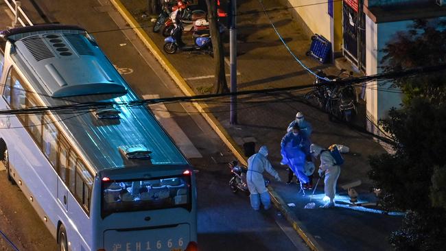 Health workers in Shanghai during a Covid lockdown. Picture: Hector Retamal/AFP