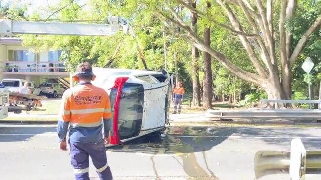 Car drives off bridge in Nambour