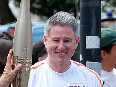 PARIS FRANCE 2024 OLYMPIC GAMES. Nine CEO Mike Sneesby carries the Paris Olympics torch in the Olympic torch relay. Pic: JACQUELIN MAGNAY