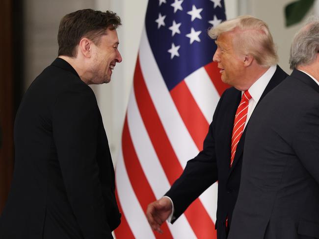 US President Donald Trump greets Tesla CEO Elon Musk before a state dinner at the Lusail Palace on May 14 in Doha, Qatar. Picture: Getty