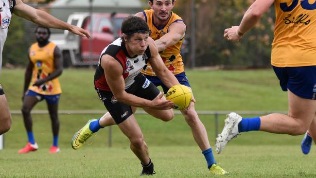 Southern Districts' Luke Kiel in typical pose, head down and looking forward with the ball in hand. Picture: Tymunna Clements AFLNT Media