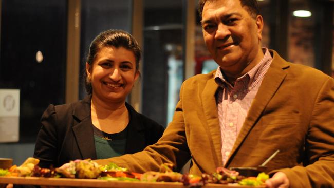 Sona Rawal and Arun Bakshi, who co-own Kebabiya along with Sanjeev Sharma, hold the massive Kebabiya platter.