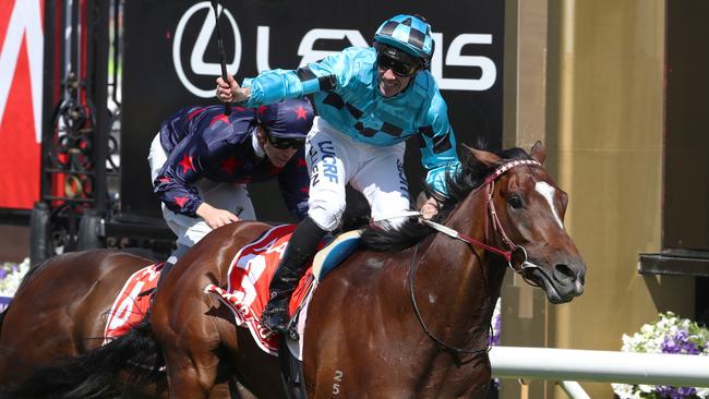 Extra Brut ridden by jockey John Allen wins the AAMI Victorian Derby during the AAMI Victoria Derby Day, as part of the Melbourne Cup Carnival, at Flemington Racecourse in Melbourne, Saturday, November 3, 2018. (AAP Image/David Crosling) NO ARCHIVING, EDITORIAL USE ONLY