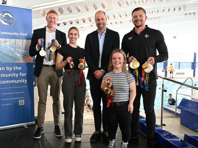 Prince William with British Olympians and Paralympians Adam Peaty (R), Tom Dean (L), Maisie Summers-Newton (front R) and Louise Fiddes (2nd L). Picture: Getty Images