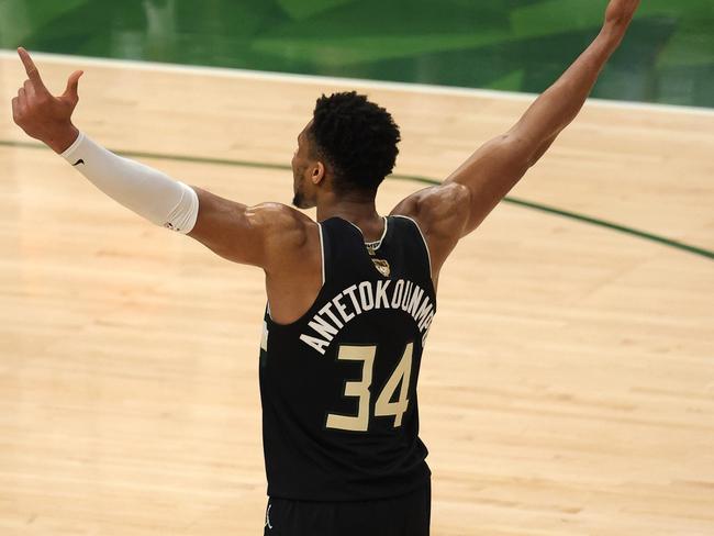 Giannis Antetokounmpo celebrates the crowning achievement of his career. (Photo by Jonathan Daniel/Getty Images)