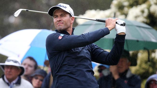 Adam Scott had a poor showing at the World Cup by his standards. during early rain. Picture: Michael Klein