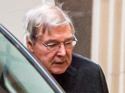 Australian Cardinal George Pell (L) is escorted into the Supreme Court of Victoria in Melbourne on June 6, 2019. - Pell asked appeals court judges to quash his landmark conviction for child sex abuse, branding the charges against him "bizarre" and "impossible". (Photo by ASANKA BRENDON RATNAYAKE / AFP)