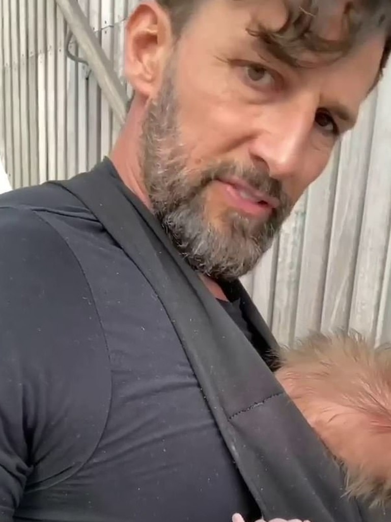 Little Elle was strapped to Tim's chest during his gruelling workout. Picture: Instagram@mrtimrobards