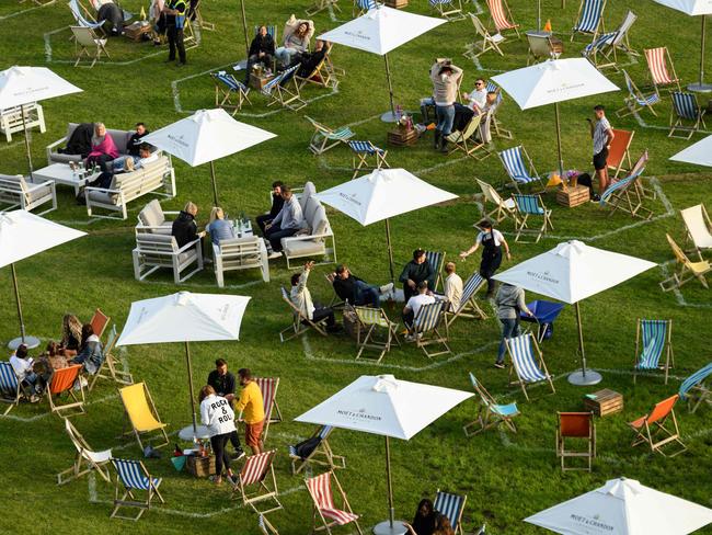 Festival-goers experience the Gisburne Park Pop-Up, the first purpose built socially-distanced outdoor festival in the UK, whilst in their designated pitches on the Gisburne Park Estate in the village of Gisburn, near Clitheroe, northern England on July 11, 2020. - Guests book their own individual hexagonal pitch, each large enough for a social bubble of six and spaced 2.6m apart. Drinks and food are delivered to the hexagonal pitches, eliminating the need for queuing. The festival runs for eight weeks until August 30, 2020 and features: DJs, film screenings, opera and family Sing-alongs. Ten onsite bell tents provide overnight accommodation for festivalgoers staying for a weekend. (Photo by OLI SCARFF / AFP)