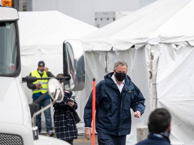 New York City Mayor Bill De Blasio wears a mask while visiting a temporary hospital at the national tennis centre. New York is the epicentre of the pandemic. Picture: AFP