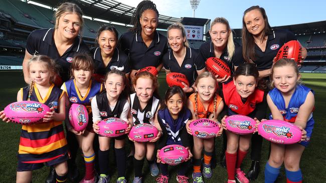 Brianna Davey, Darcy Vescio, Sabrina Frederick-Traub, Lauren Arnell, Tayla Harris and Daisy Pearce with aspiring women’s football stars. Picture: Alex Coppel.