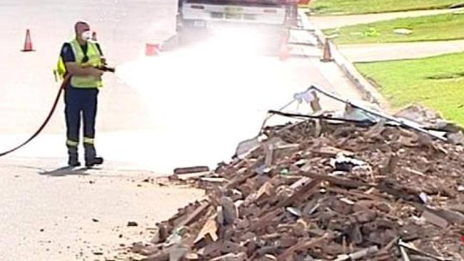 Hazmat workers remove five tonnes of building debris contaminated with asbestos from Bentley St in Wetherill Park. Picture: Seven News