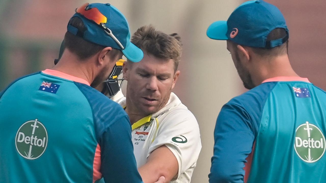 Warner fractured his elbow in the second Test against India. (Photo by Money SHARMA / AFP)