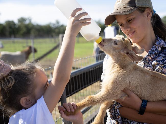 Girl feeding baby goat, Splitters Farm, Unique rural camping & farm stay experience, Tourism Queensland farm stays - Photo Tourism and Events Queensland Narelle Bouveng