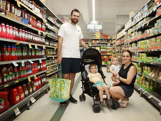 10/3/23: Jack and Eilish Armsworth with Billy 8 months and James 2 at Ritchies IGA at Nth Ryde talking about the cost of living. John Feder/The Australian.