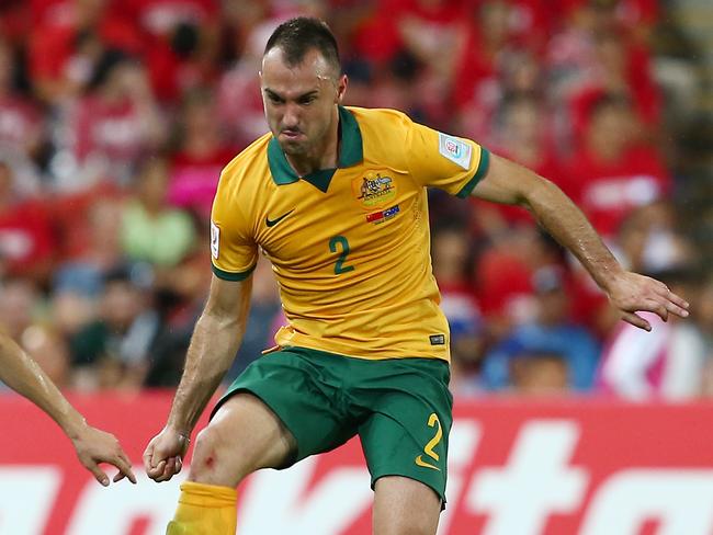 Australia's Ivan Franjic kicks the ball away rom China's Ji Xiang, left, during the AFC Asia Cup quarterfinal soccer match between China and Australia in Brisbane, Australia, Thursday, Jan. 22, 2015. (AP Photo/Tertius Pickard)