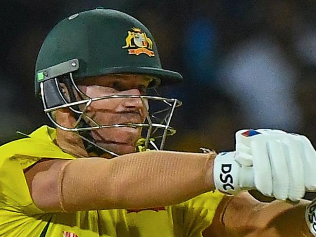 Australia's David Warner plays a shot during the fourth one-day international (ODI) cricket match between Sri Lanka and Australia at the R. Premadasa International Cricket Stadium in Colombo on June 21, 2022. (Photo by ISHARA S. KODIKARA / AFP)