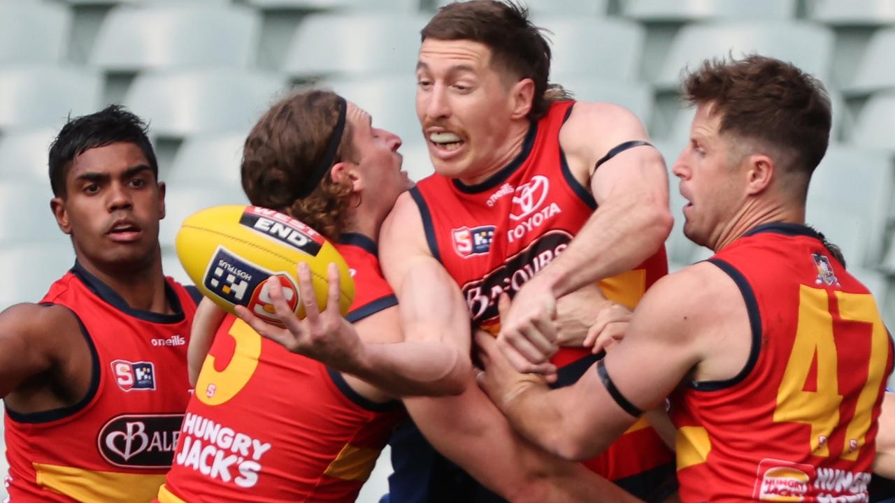 Adelaide ruckman Kieran Strachan handballs under pressure during this year’s SANFL preliminary final against Sturt at Adelaide Oval. Picture: David Mariuz/SANFL