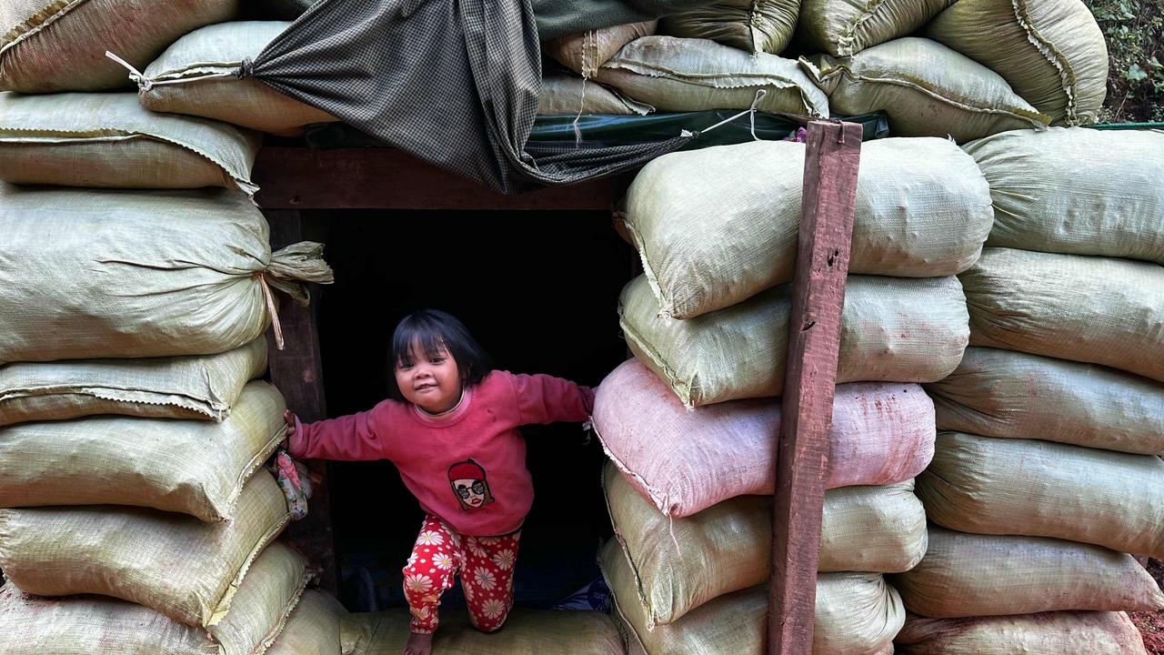 This photo taken on December 14, 2023 shows a girl playing in a bomb shelter near her home amid clashes between the ethnic minority armed group Ta'ang National Liberation Army (TNLA) and Myanmar's military. Photo: AFP