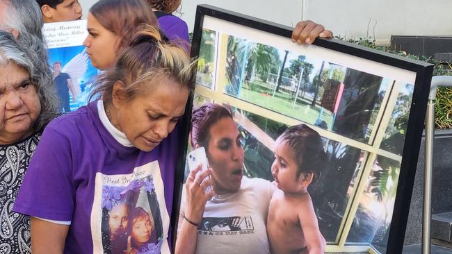 Alison Miller holds a framed picture of her dead sister Diane and her firstborn son Lloyd. Picture: NCA NewsWire / Anthony Anderson